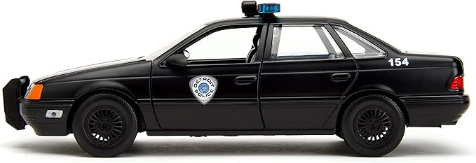 Carro Ford Taurus 1986 con Figura Robocop Esc:1:24 8a+